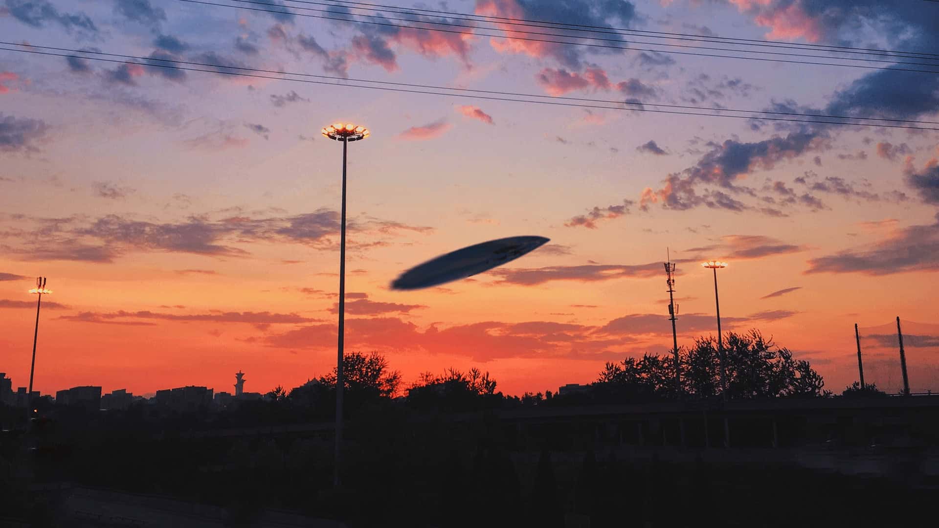 Illustration of a Disc Flying as Sun Sets in the Background