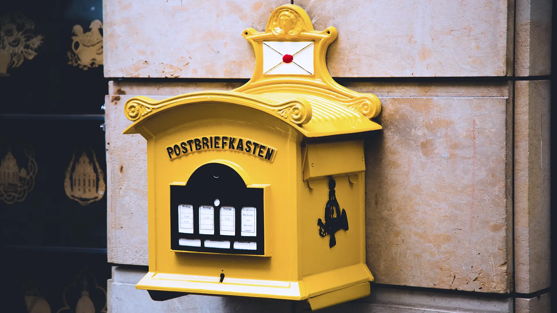photo of a yellow german mailbox